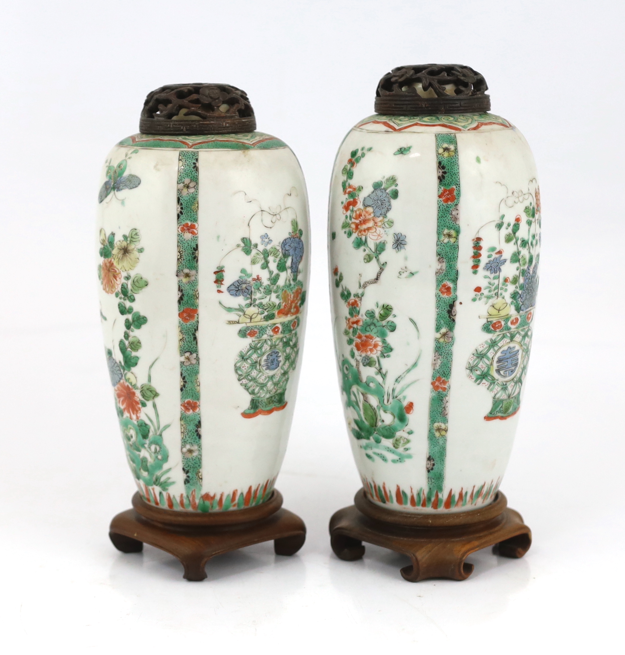 A near pair of Chinese famille verte jars, Kangxi period, on wood plinths, blue enamels repainted